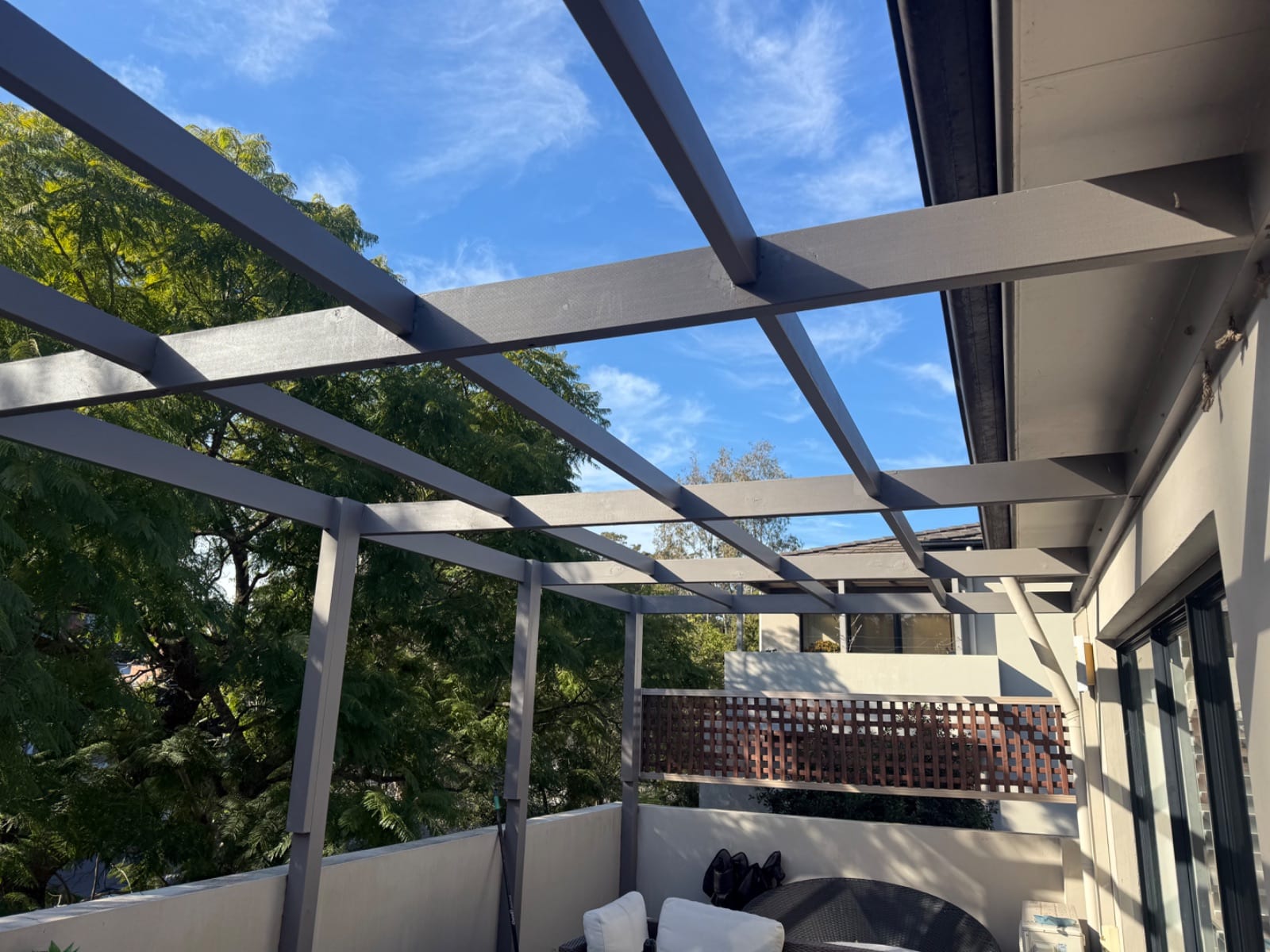 Shade cloth installed over a balcony pergola on a unit in Greenwich