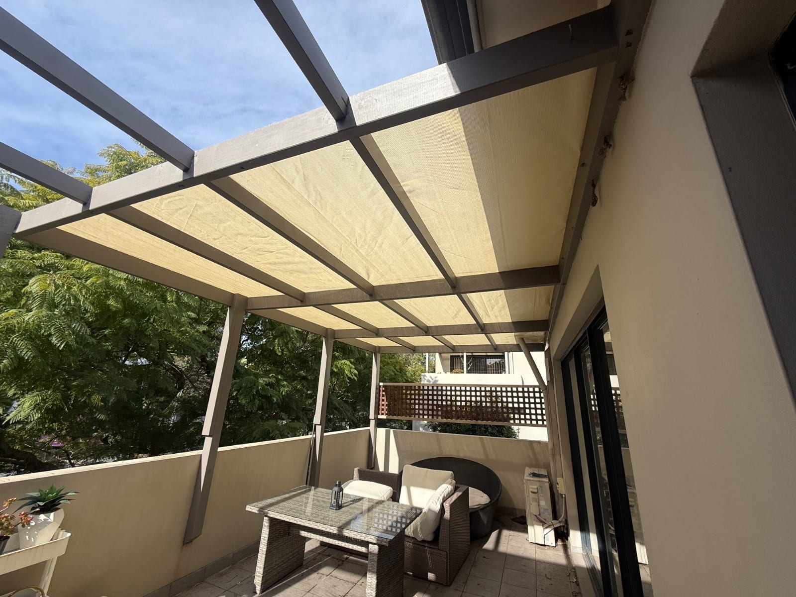 Shade cloth installed over a balcony pergola on a unit in Greenwich
