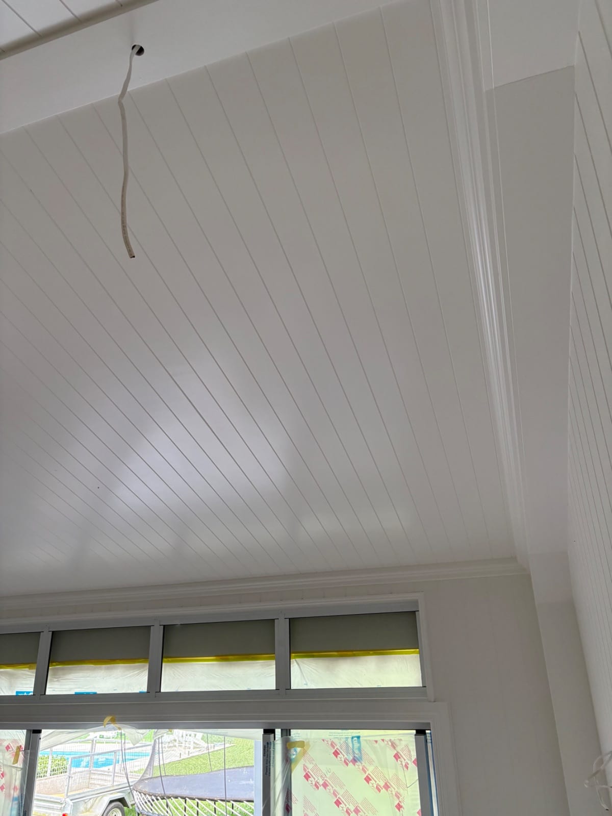 Interior and exterior spray repaint of a low-set weatherboard home in Redlynch Valley
