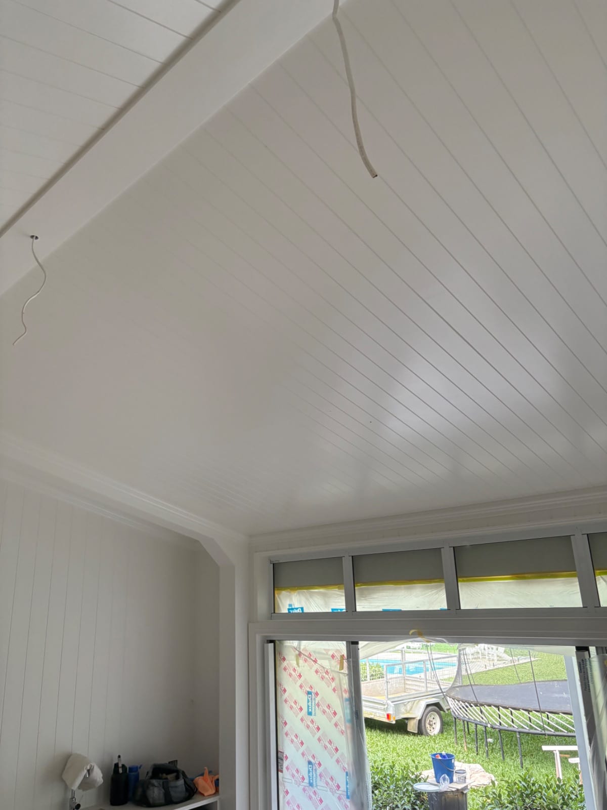 Interior and exterior spray repaint of a low-set weatherboard home in Redlynch Valley